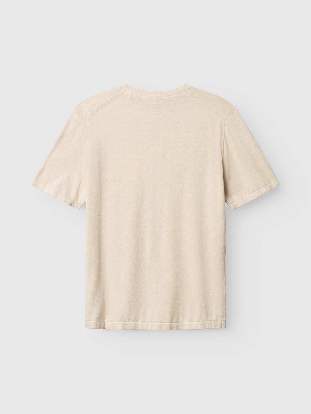 The Gabba GABvento Dush SS Knits in Sand Mel is shown from the back, featuring a plain, short-sleeve knit design and displayed against a white background.