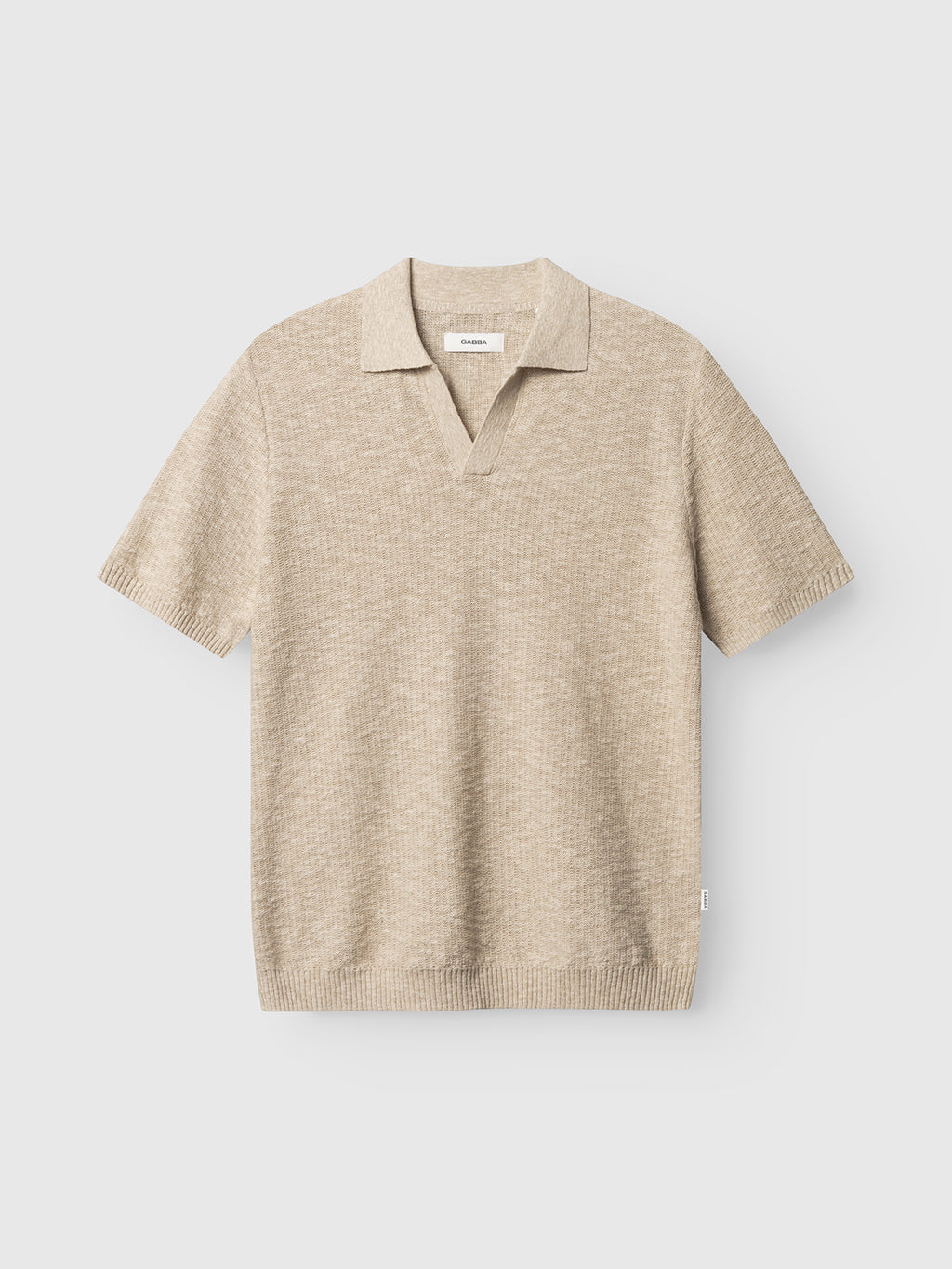 The Gabba GABcross Alto SS Knit in Ecru is a short-sleeve polo featuring ribbed hem, collar, and sleeves, shown against a plain white background.