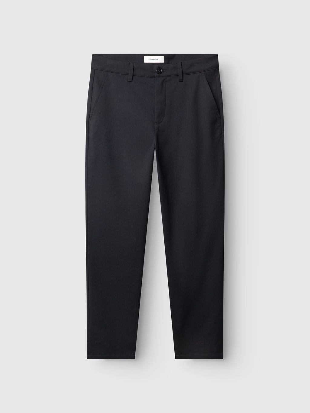 The Gabba GABpaul Deme Pant in dark navy features a straight-leg fit, side pockets, and button closure. Crafted from two-tone yarn for subtle texture, the trousers are displayed against a plain light gray background.