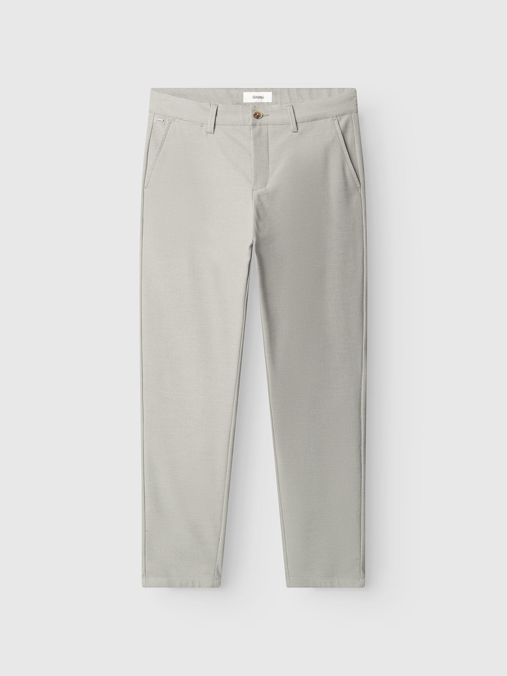 The Gabba GABpaul Deme Pant in Mineral Gray is a slim-fit trouser with a micro-pattern, belt loops, side pockets, and a front zipper with a single button closure, shown against a plain white background.
