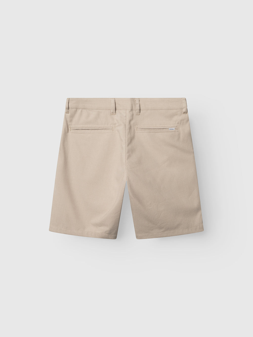 The Gabba GABjet Deme Shorts in Birch are slim-fit chino shorts with a classic silhouette, featuring two back welt pockets, belt loops, and a button closure, displayed on a plain white background.