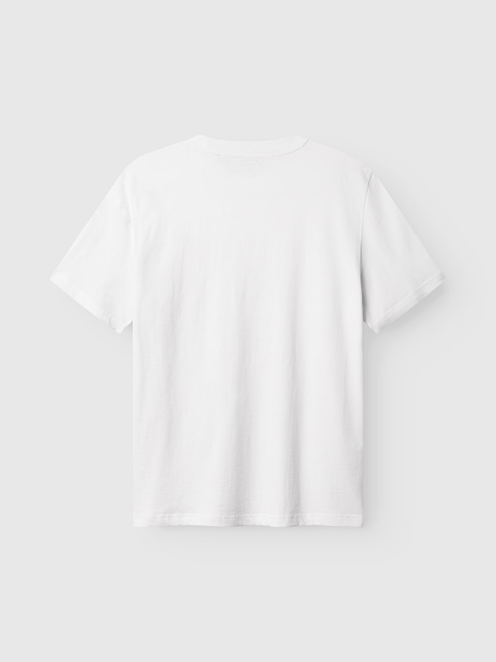 The Gabba GABnigel Boxy Logo GOTS SS t-shirt in white is shown from the back against a light gray background, featuring short sleeves and a plain design with no visible logos or text.