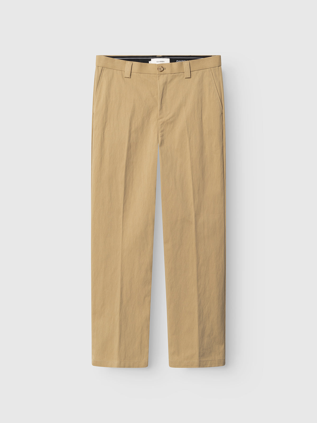 The Gabba GABdenver Fuggies Pant in Sand features a durable, straight-leg design with belt loops, button closure, and side pockets, shown neatly laid flat on a plain white background.