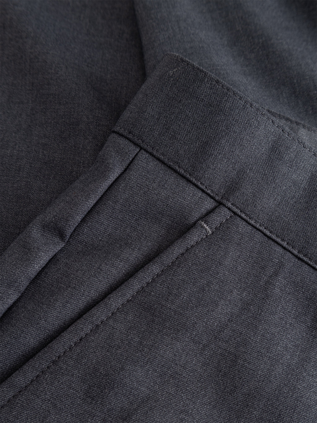 Close-up of the light grey GABjoe Turnup Fin Pant by Gabba, featuring detailed stitching on a viscose blend twill fabric and a neatly finished pocket.