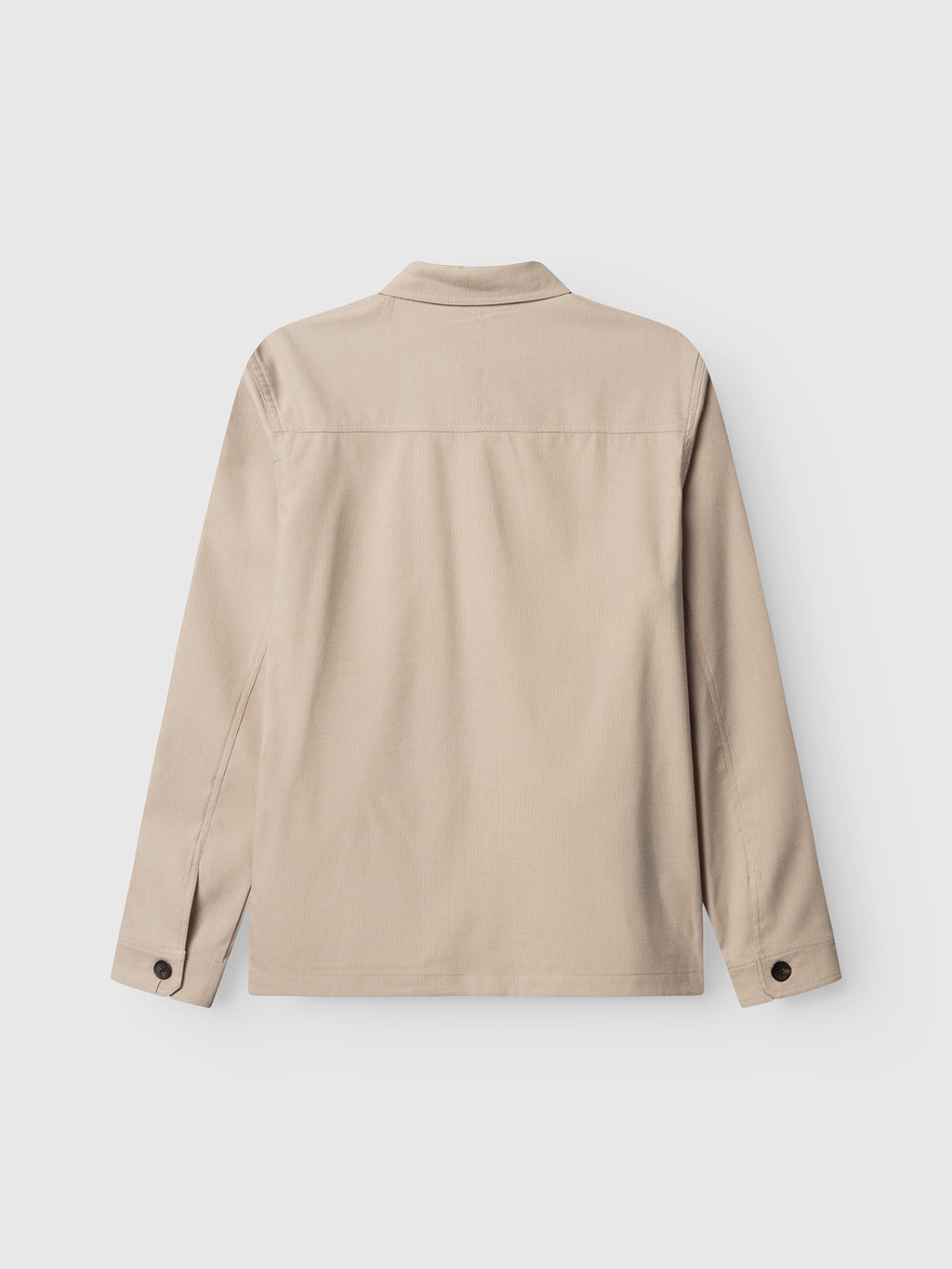 Gabba GABtogger Base Deme LS Overshirt in Birch, shown from the back, features a straight hem, pointed collar, and buttoned cuffs in micro-pattern woven fabric—perfect for layering against a plain white background.