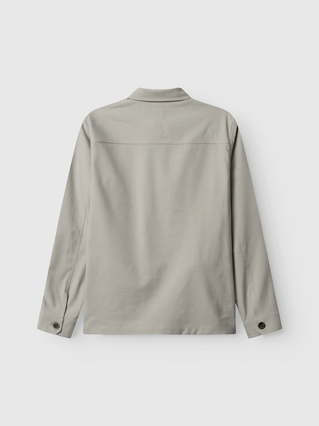 The Gabba GABtogger Base Deme LS Overshirt in Mineral Gray is shown from the back, with buttoned cuffs, a straight hem, and micro-pattern woven fabric, displayed against a plain white background.