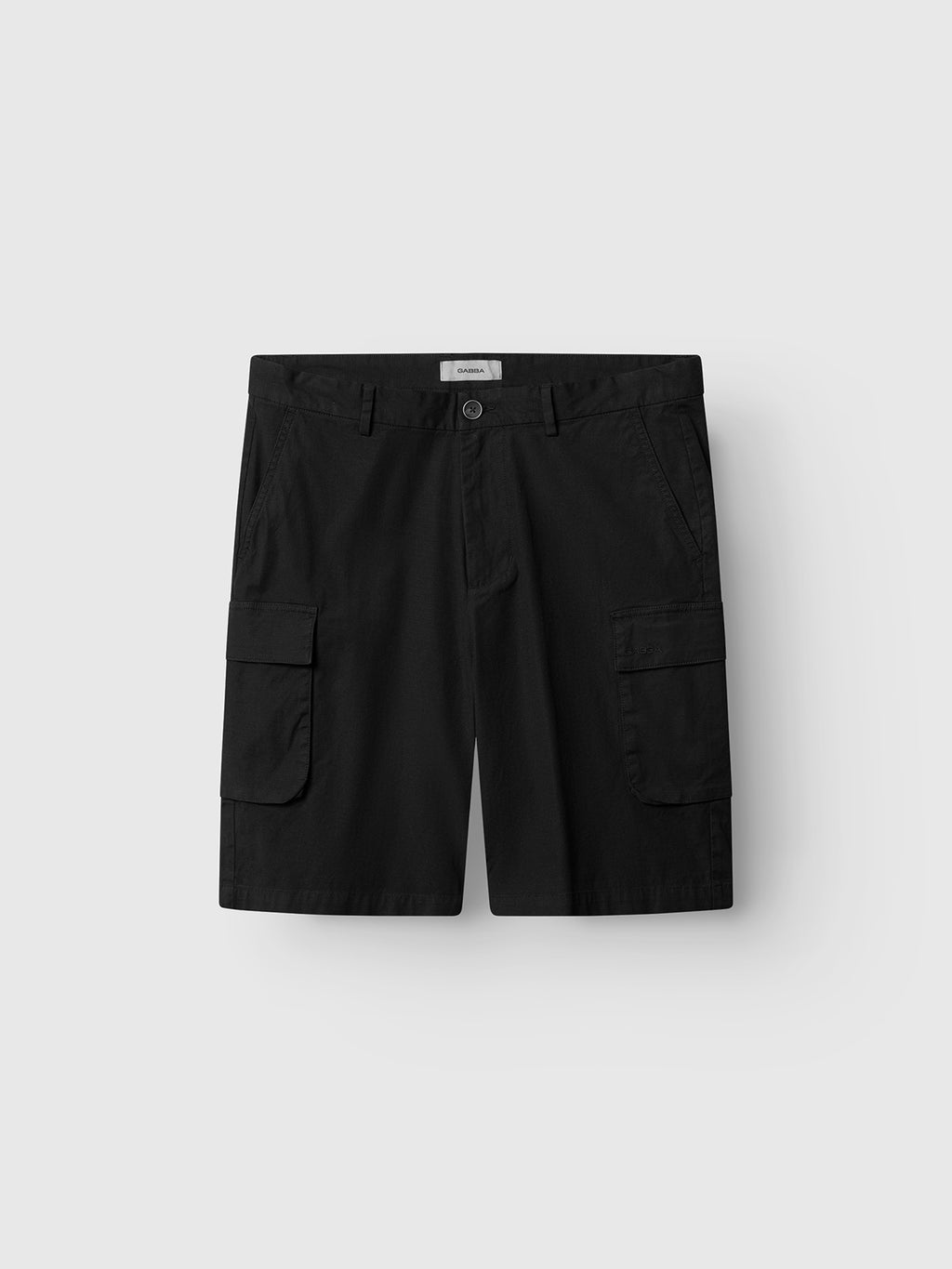 The Gabba GABjoli Cargo Ribstop Shorts in black feature a relaxed fit, button and zipper closure, front pockets, and large side cargo pockets. Shown against a plain light gray background.