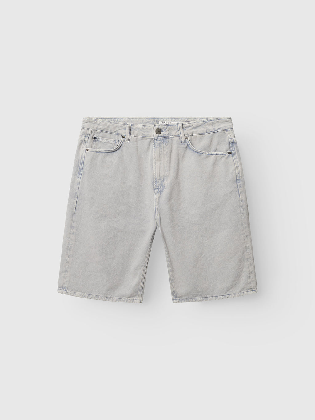 The GABmox Antiq Shorts - Denim Blue by Gabba are relaxed-fit shorts made from rigid twill, featuring five pockets and a front button and zipper closure, shown flat on a plain white background.