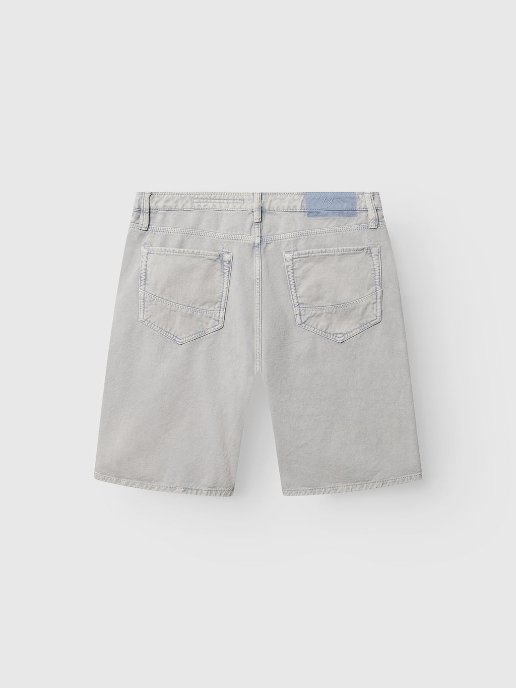Gabba GABmox Antiq Shorts in Denim Blue, shown from the back with two rear pockets with visible stitching and a blue waistband patch. Made from rigid twill fabric and displayed flat on a light background.