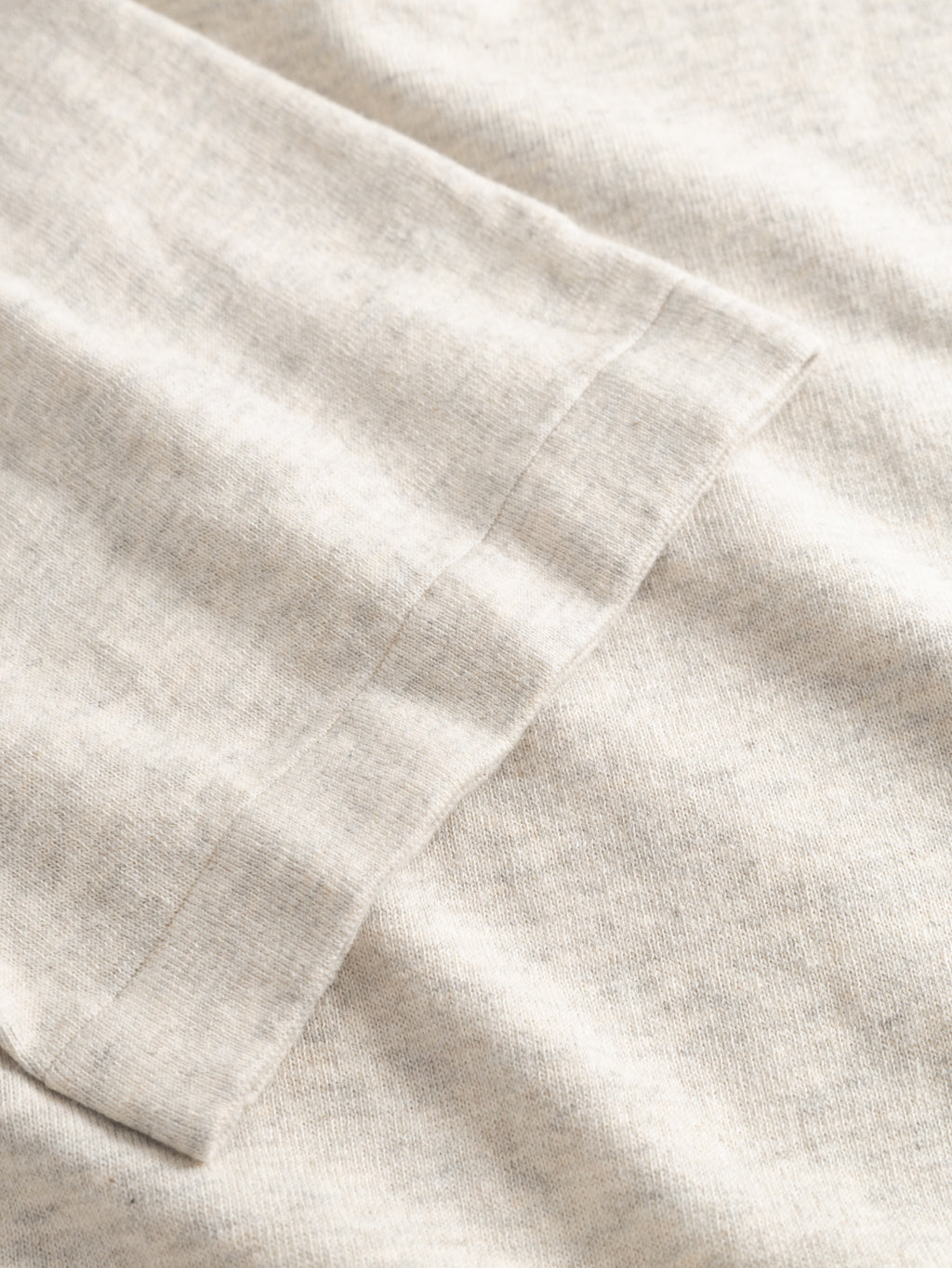 Close-up of the soft, heathered sand melange fabric and neat hem on the Gabba GABbenson New Cot SS Knit men's polo—showcasing its quality and comfort in a regular fit short sleeve.