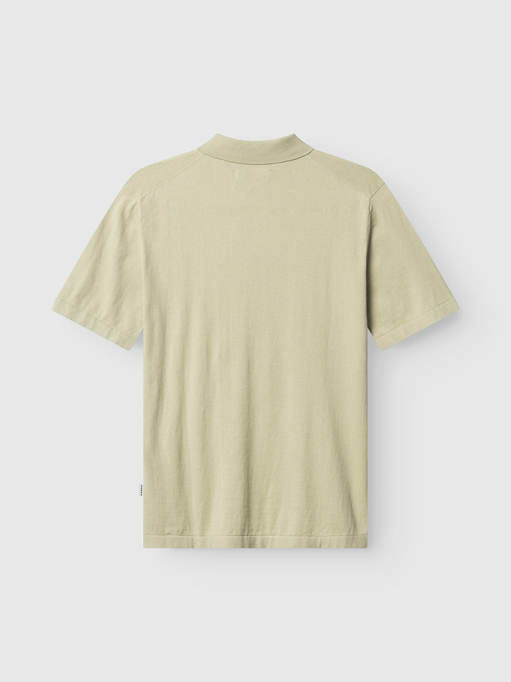 The Gabba GABbenson New Cot SS Knit polo in Alfa Green is shown from the back against a white background.