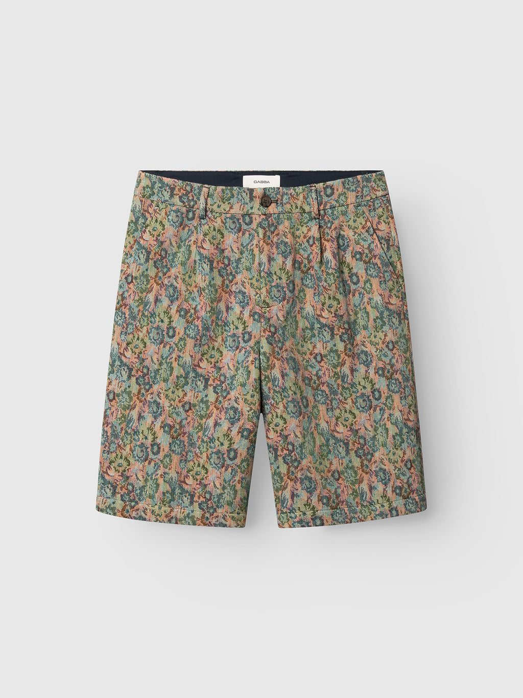 The Gabba GABjoli Ted Kscope Shorts feature a relaxed fit and an abstract floral pattern in green, orange, blue, and beige, offering versatile style. They are displayed against a plain light gray background.