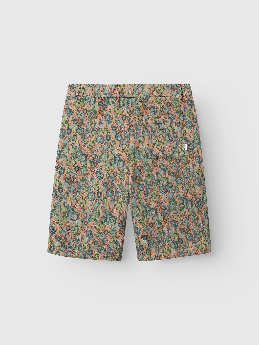 The Gabba GABjoli Ted Kscope Shorts feature an abstract floral pattern in green, blue, and pink, crafted from textured fabric and shown flat on a plain white background.