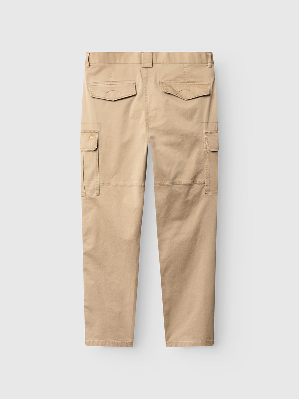 Gabba GABjoe Vico Cargo Pant in Sand, shown from the back. Made from cotton stretch, these tapered-fit pants have two back flap pockets with buttons, large side cargo pockets, sturdy fabric, and straight-cut legs for a utilitarian style.