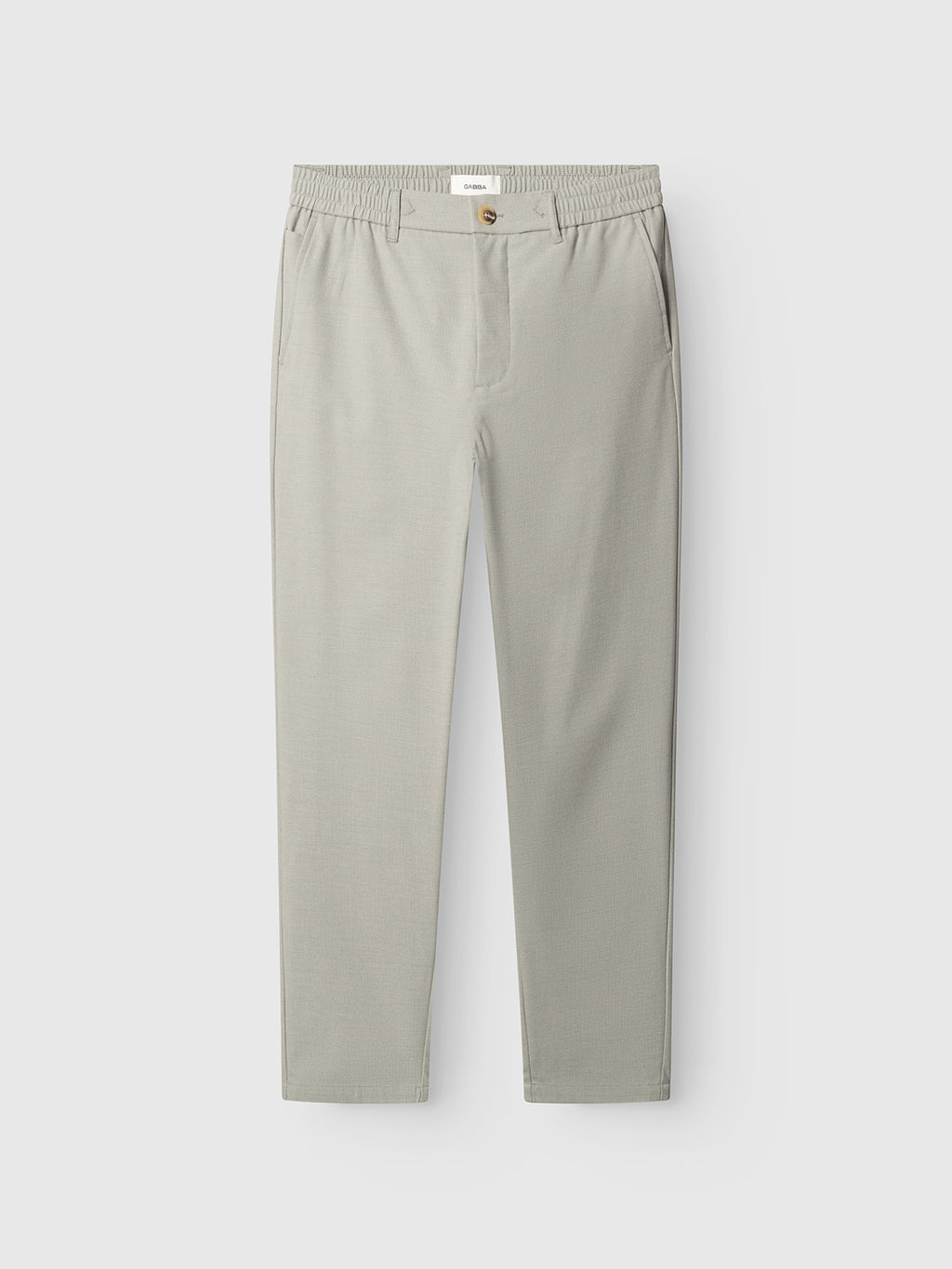 The Gabba GABmonza Tasca Deme Pant in Mineral Gray features a straight-leg fit, elastic waistband, button closure, and side pockets, shown against a plain white background.