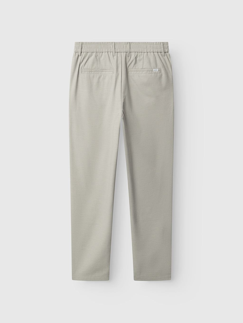 The Gabba GABmonza Tasca Deme Pant in Mineral Gray is shown laid flat from the back, highlighting its elastic waistband and two back welt pockets. The fabric has a smooth, lightweight appearance.