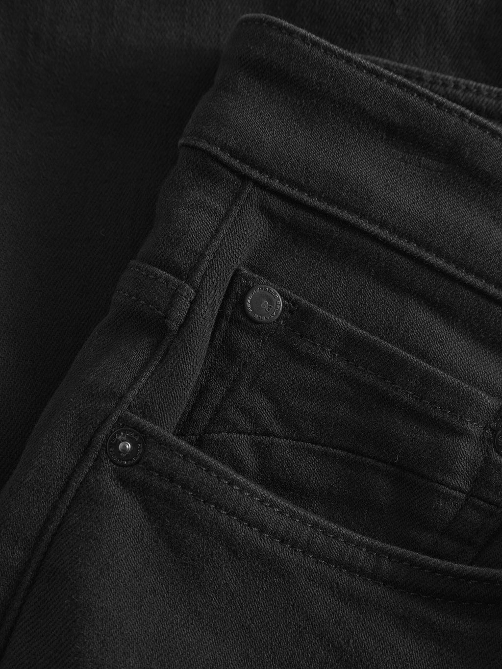 Close-up of the front pocket and waistband of the Gabba GABmarc Sword - Black Denim jeans, highlighting intense black fabric, detailed stitching, and metal rivets for a sharp, clean look.