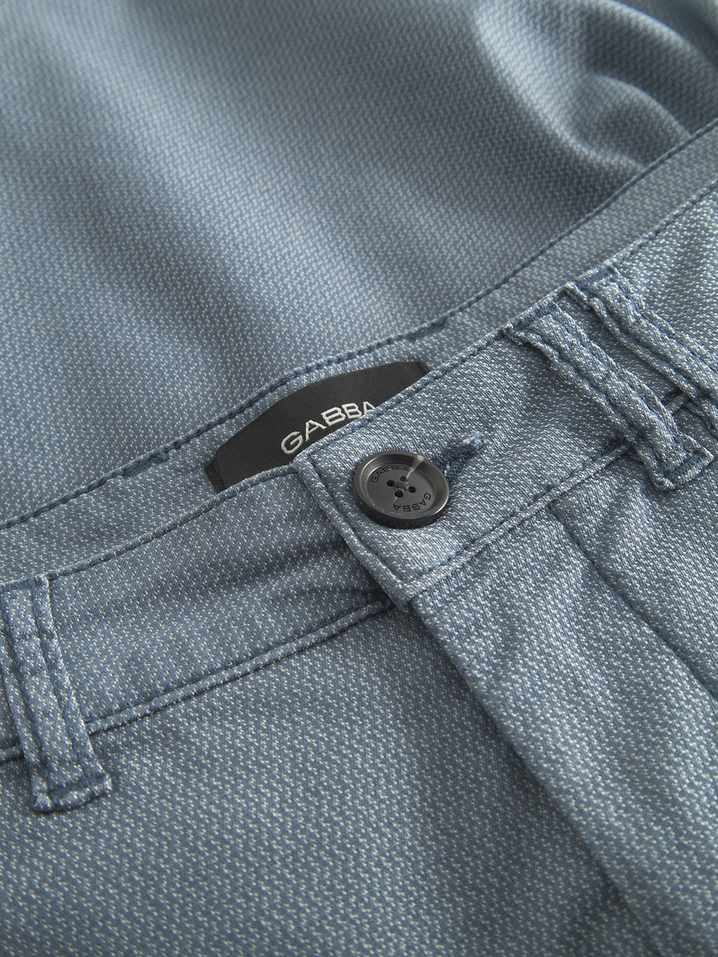 Close-up of the waistband and button on Gabba's GABjet K3280 Dale Shorts in blue, with visible belt loops and a black Gabba label—signature details from their relaxed fit shorts collection.