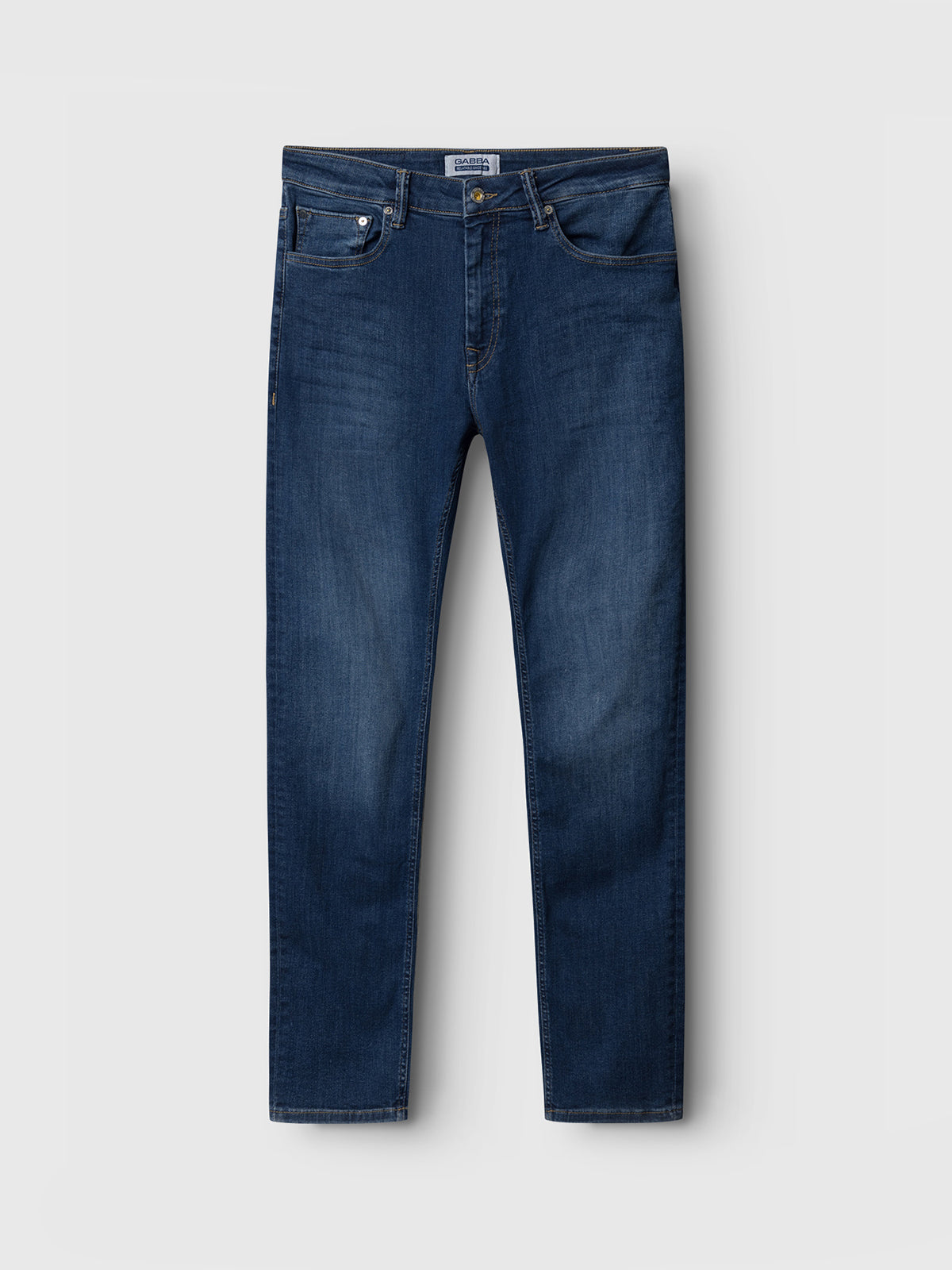 The Gabba GABjones K3870 - Mid Blue Denim jeans feature a classic slim fit with a straight-leg cut, button and zipper closure, front and back pockets, and are crafted from super-stretch fabric for superior flexibility. Shown against a light gray background.