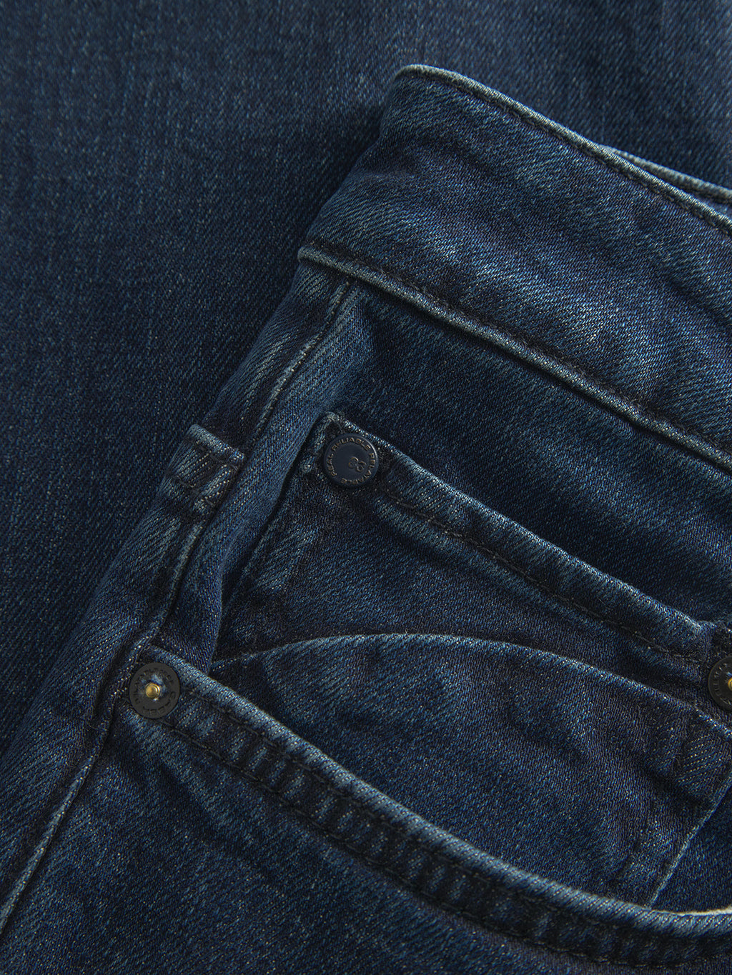 Close-up of the front and coin pockets on Gabba GABmarc Mego dark blue denim jeans, highlighting visible stitching, metal rivets, and textured fabric crafted with Wiser Wash technology.