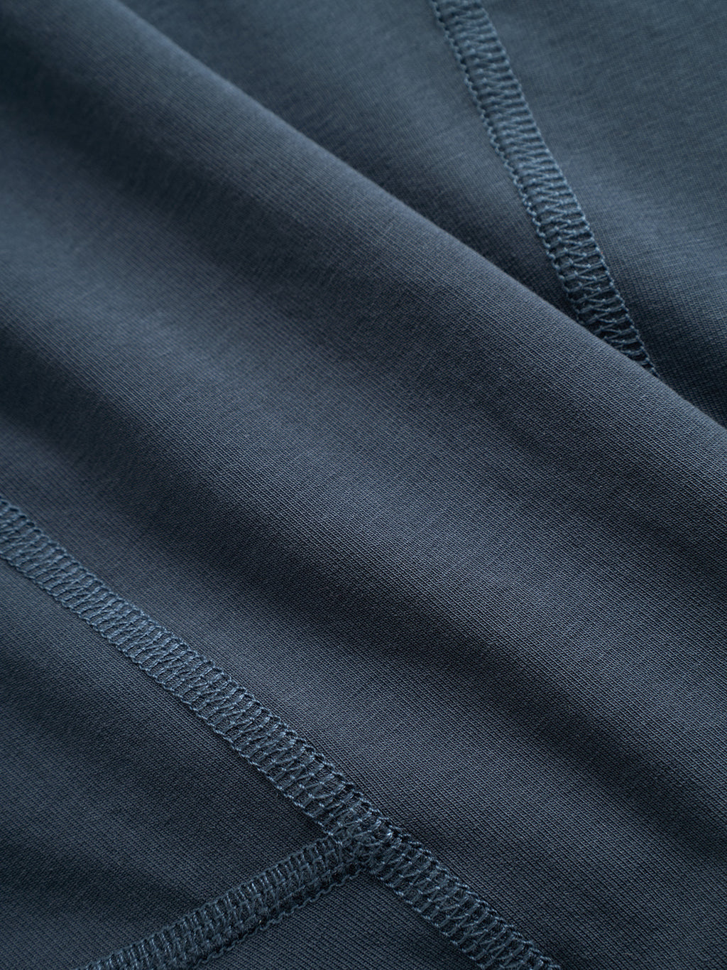 Close-up of Gabba Trunk New - Black Iris underwear in a dark blue cotton blend, showing visible stitching, smooth texture, and diagonal overlaps—ideal for comfortable trunks with a Gabba logo waistband.