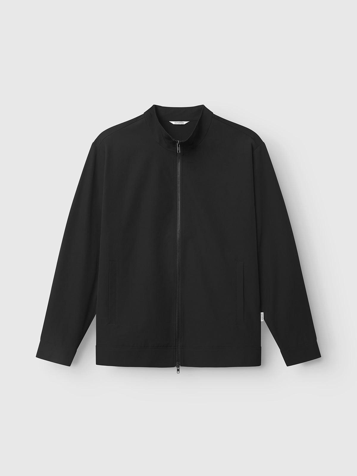 The Gabba GABnik Tech - Black jacket is a practical, long-sleeve outerwear piece crafted from durable tech material, featuring a zip front, flat collar, and side pockets, displayed against a plain light gray background.