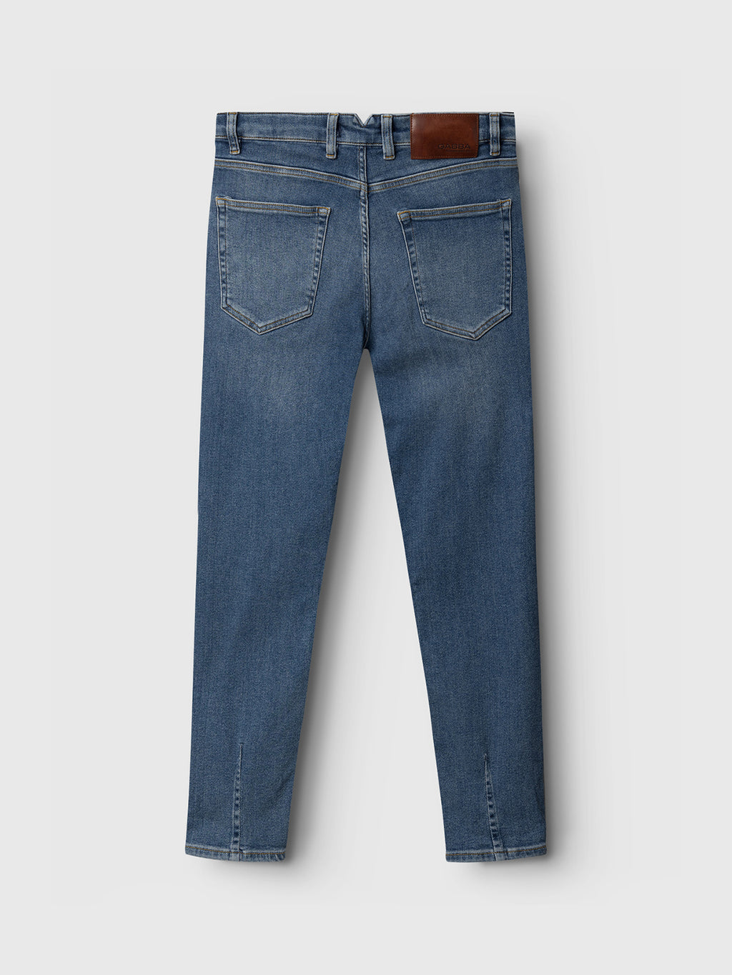 Back view of GABBA Alex K3948 Jeans in denim wash, featuring two back pockets, tan stitching, a brown leather waistband patch, worker-cut waistbands, and straight legs. Displayed against a plain light gray background.