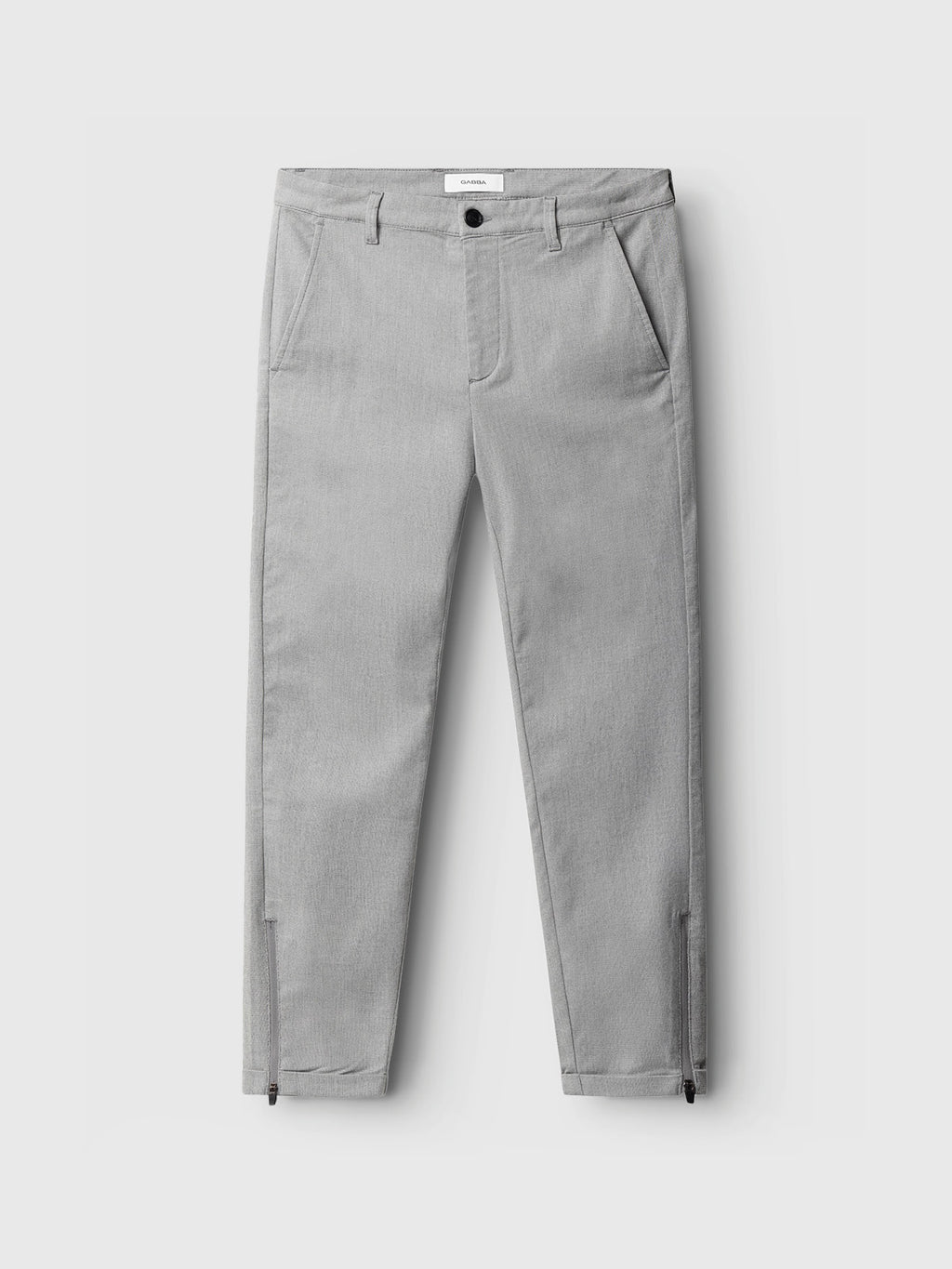 Pisa Domo Pants - Monument by Gabba, featuring a light gray color, button and zip fly, front pockets, belt loops, and ankle zippers, are laid flat on a white background.