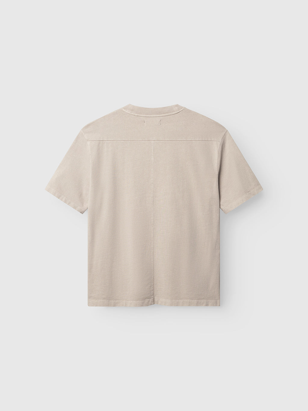 The Gabba GABnigel Wix Boxy Hour SS - Sand Cashmere is a beige, heavyweight cotton t-shirt with short sleeves, a boxy fit, minimal detailing, and a visible vertical seam down the back.