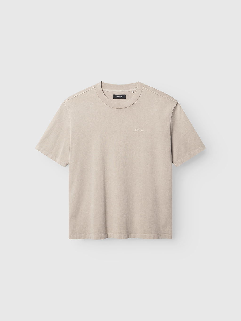 The Gabba GABnigel Wix Boxy Hour SS in Sand Cashmere is a short-sleeved, heavyweight cotton crewneck t-shirt with a boxy fit and subtle left chest logo, shown against a light grey background.