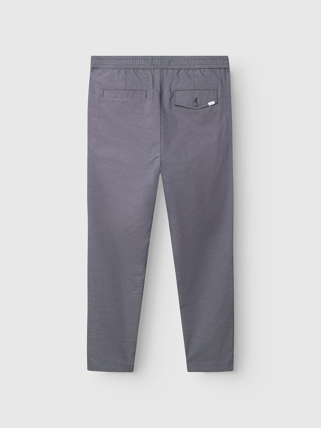 Back view of the Gabba Monza Button Carre pants in navy, featuring a relaxed straight fit, elastic waist, two back pockets (one with button closure and a small tag), displayed against a plain white background.