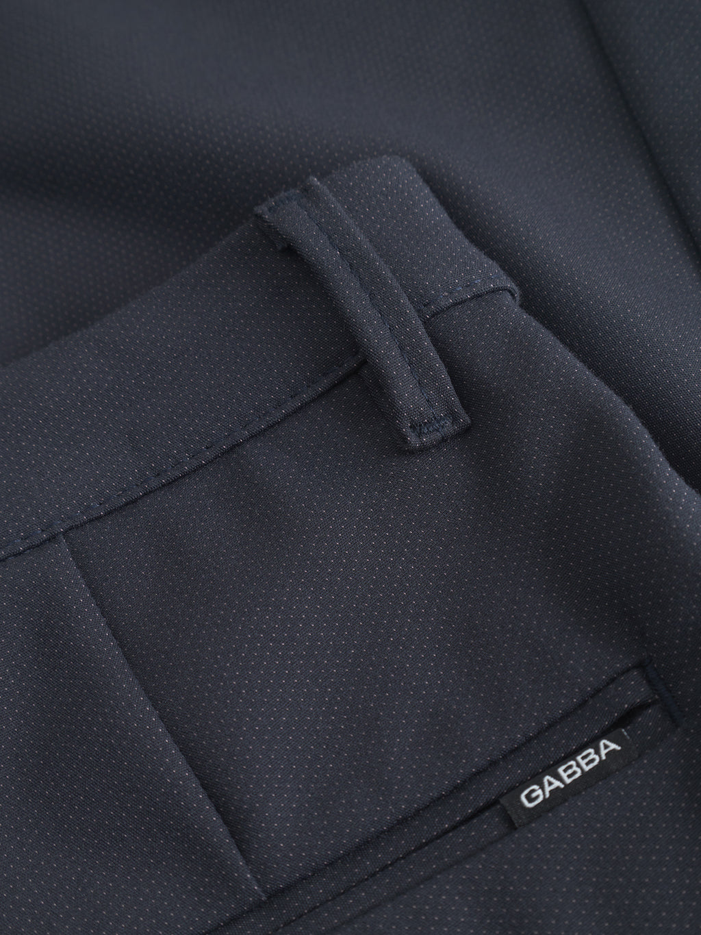 Close-up of GABBA Pisa Small Dot - Navy pants, featuring a back pocket, belt loop, and a subtle dotted texture in high-stretch cotton-blend fabric for refined metro style.