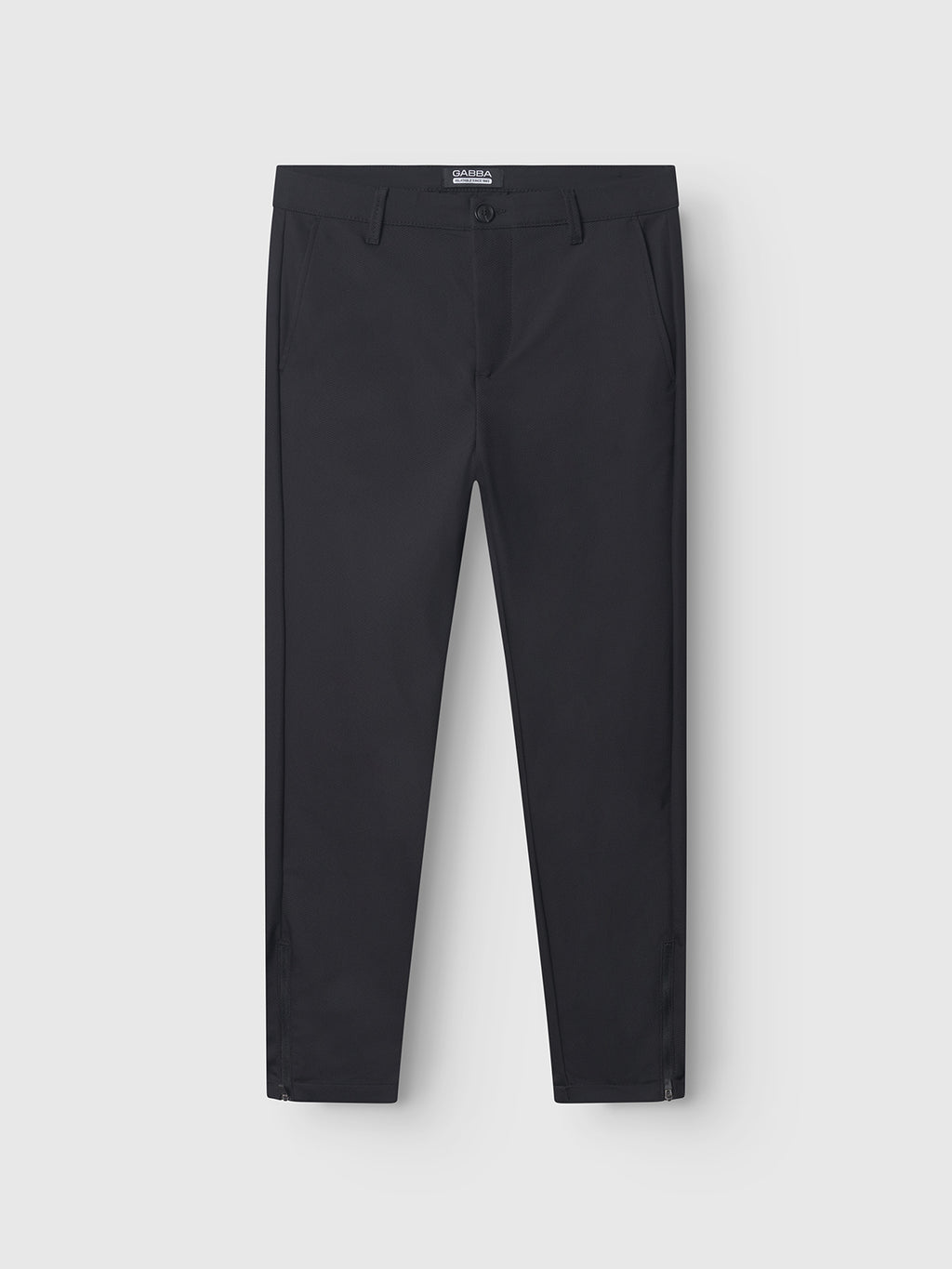 A pair of GABBA Pisa Small Dot - Black pants in high-stretch cotton-blend fabric, featuring side pockets and a front button with zipper closure, laid flat on a white background for a sleek metro style look.