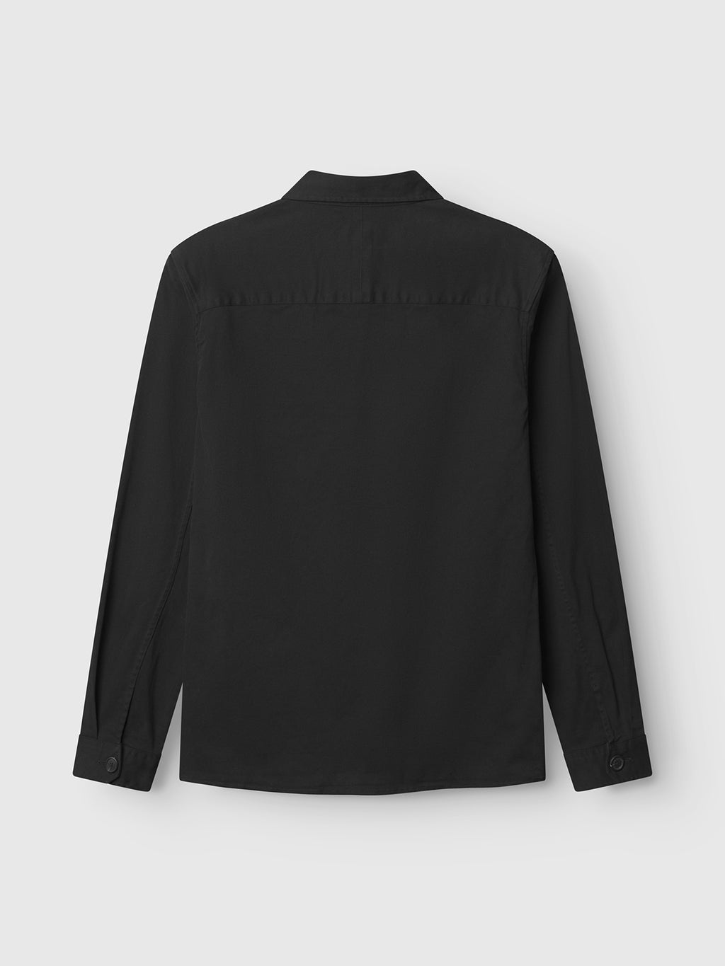 The GABBA GABtopper LS Shirt - Black is displayed from the back, laid flat on a light gray background. This long-sleeve overshirt features a classic shirt collar and buttoned cuffs.