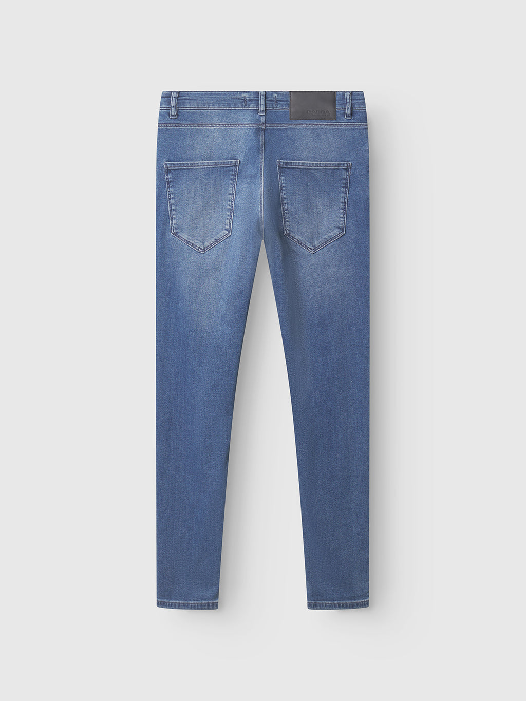 Back view of GABBA GABrey K3866 TENCEL™ Jeans in denim wash, featuring straight legs, two rear pockets, belt loops, and a black rectangular patch on the waistband, displayed against a plain light background.