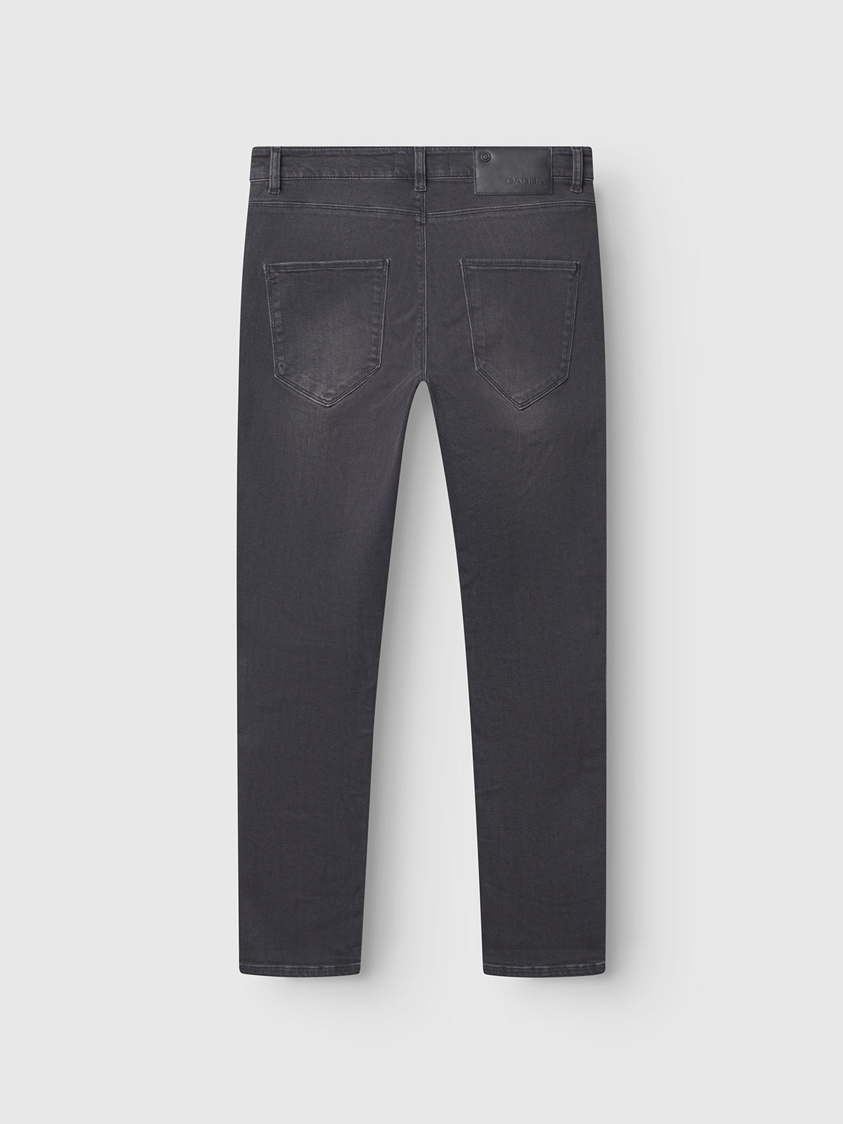 The GABBA GABrey Thor Jeans - Denim wash are dark gray straight leg jeans with two back pockets and belt loops, shown from the back and laid flat on a white background for a relaxed style.