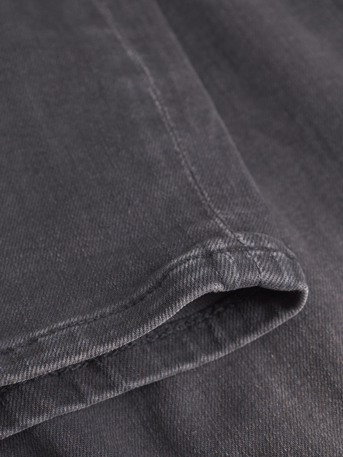 Close-up of dark grey fabric's texture and stitching—ideal for adding a laid-back touch to your favorite GABBA GABrey Thor Jeans - Denim wash.