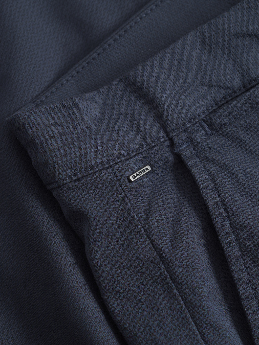 Close-up of GABBA GABpaul K3280 Dale Chino in navy, featuring French pockets and a visible brand label above the pocket seam, highlighting the detailed texture and stitching.