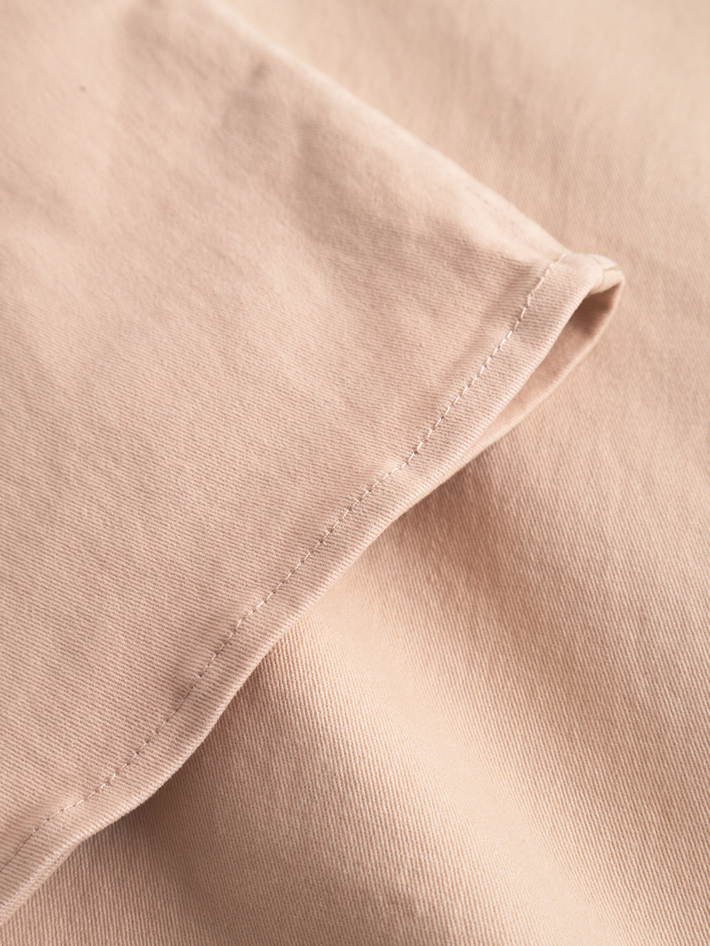 Close-up of the sleeve on the GABBA GABtopper LS Shirt in Humus, highlighting the fine stitching detail and smooth cotton texture.
