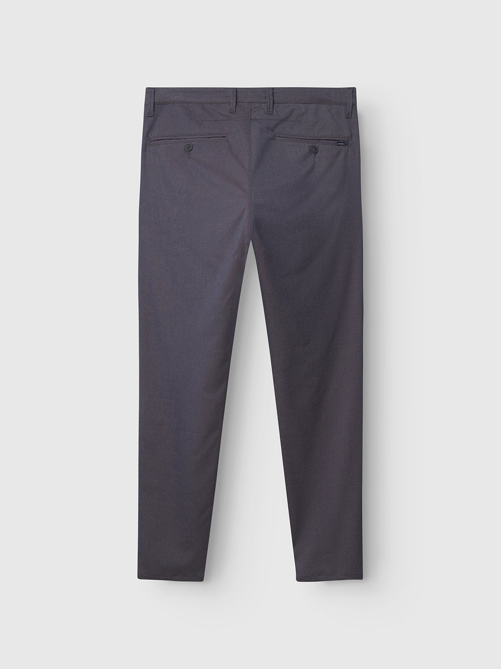 Back view of Gabba Paul Domo chino pant in dark navy melange, showing branded buttons on two back pockets—one with a button, one with a zipper—against a plain light grey background.