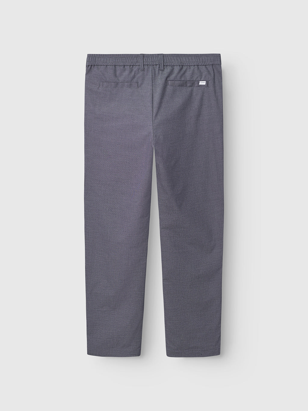 A pair of navy Gabba Napoli 19 Carre pants with a timeless design, shown from the back, featuring straight legs, an elastic waistband, and two back pockets—one with a button and one with a small rectangular label.