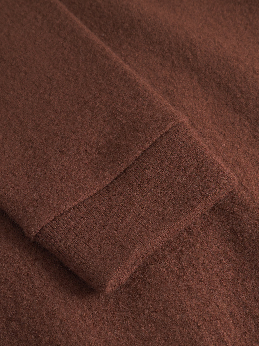Close-up of Gabba's Cardiff Led - Brownish, a long-sleeve sweater in soft, fuzzy boiled wool, showcasing its textured material and detailed sleeve cuff.