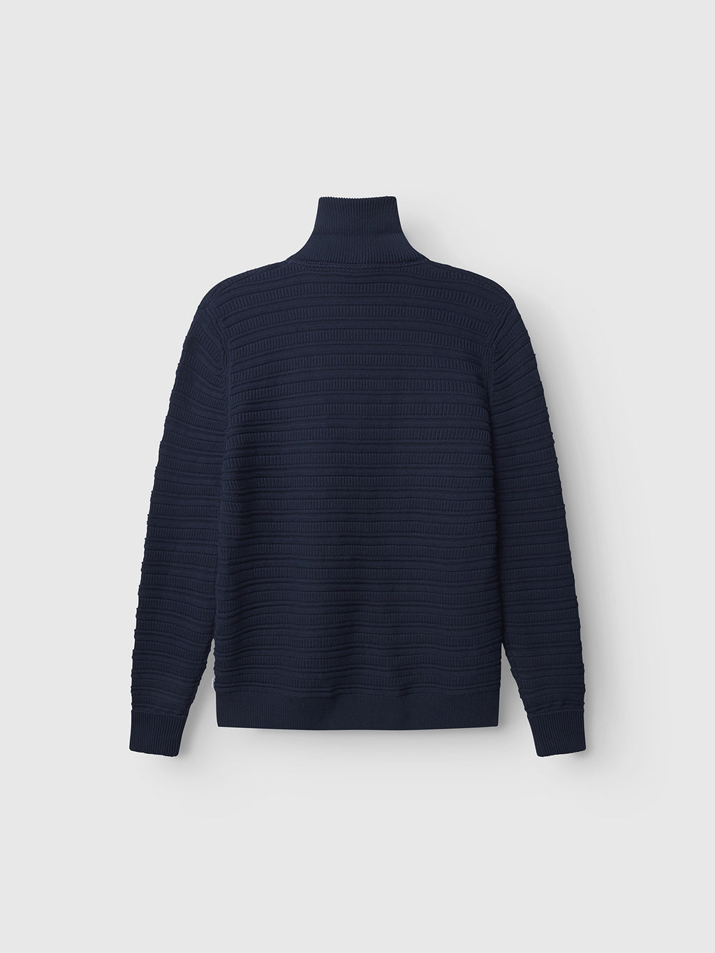 The Gabba Iwaki Buco LS - Navy, a long-sleeve ribbed cotton jumper, is shown laid flat against a light gray background with the back view visible.