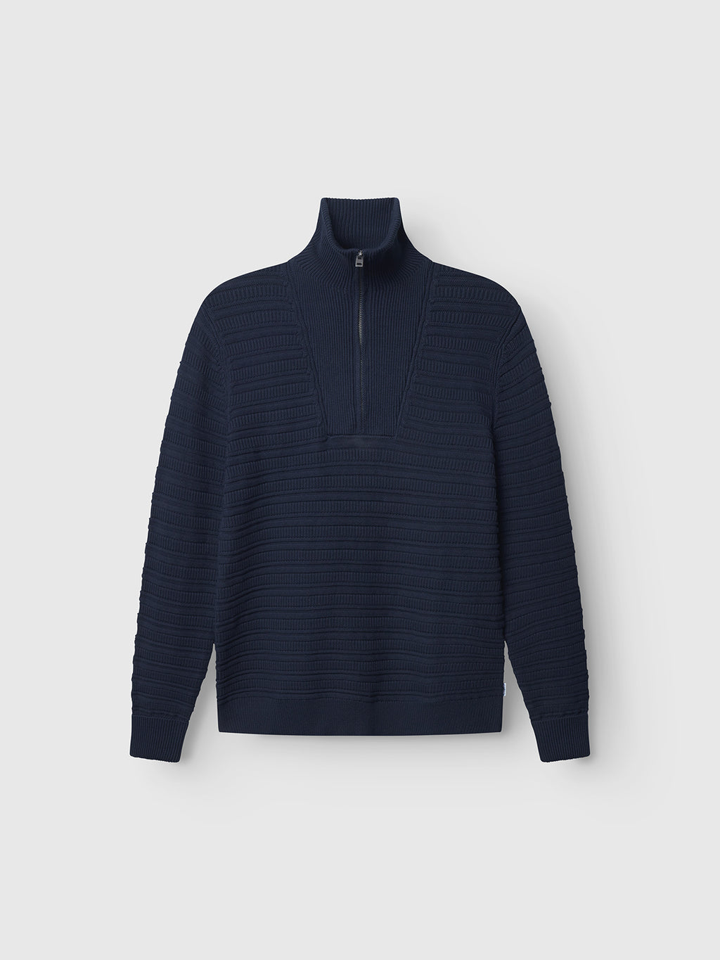 The Gabba Iwaki Buco LS - Navy is a long-sleeve cotton jumper with a ribbed knit texture and half-zip collar, shown flat on a light grey background.