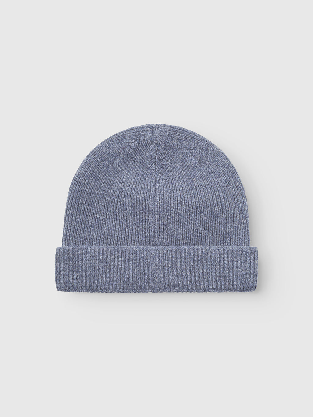 The Gabba Biella Aico beanie in vintage indigo features a ribbed knit and wide folded cuff, shown on a plain white background.