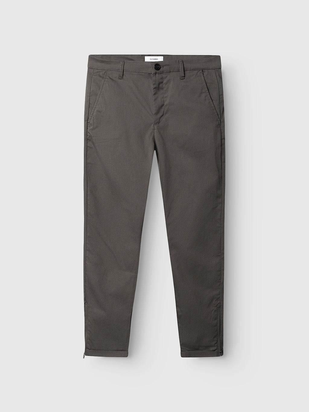 The GABBA Pisa K3280 Dale Pants in grey are crafted from a high-stretch cotton-blend, featuring front and back pockets, the brand’s signature zip detail, and a slim tapered fit; pictured laid flat on a white background.