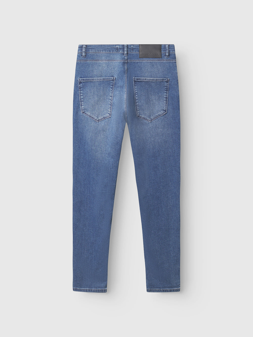 The GABBA GABrey K3866 TENCEL™ Jeans in denim wash feature a straight leg, two large back pockets, belt loops, and a black rectangular patch on the waistband for a relaxed, laid-back look.
