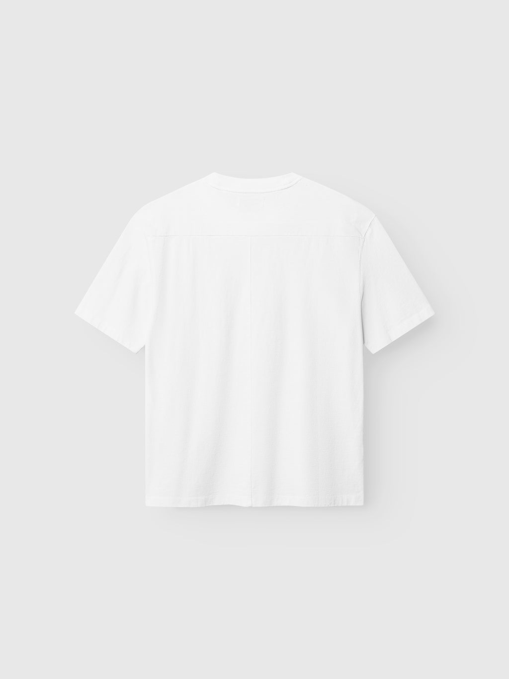 The Gabba GABnigel Wix Boxy Hour SS t-shirt in white, crafted from heavyweight cotton, is displayed laid flat with the back view on a light gray background.