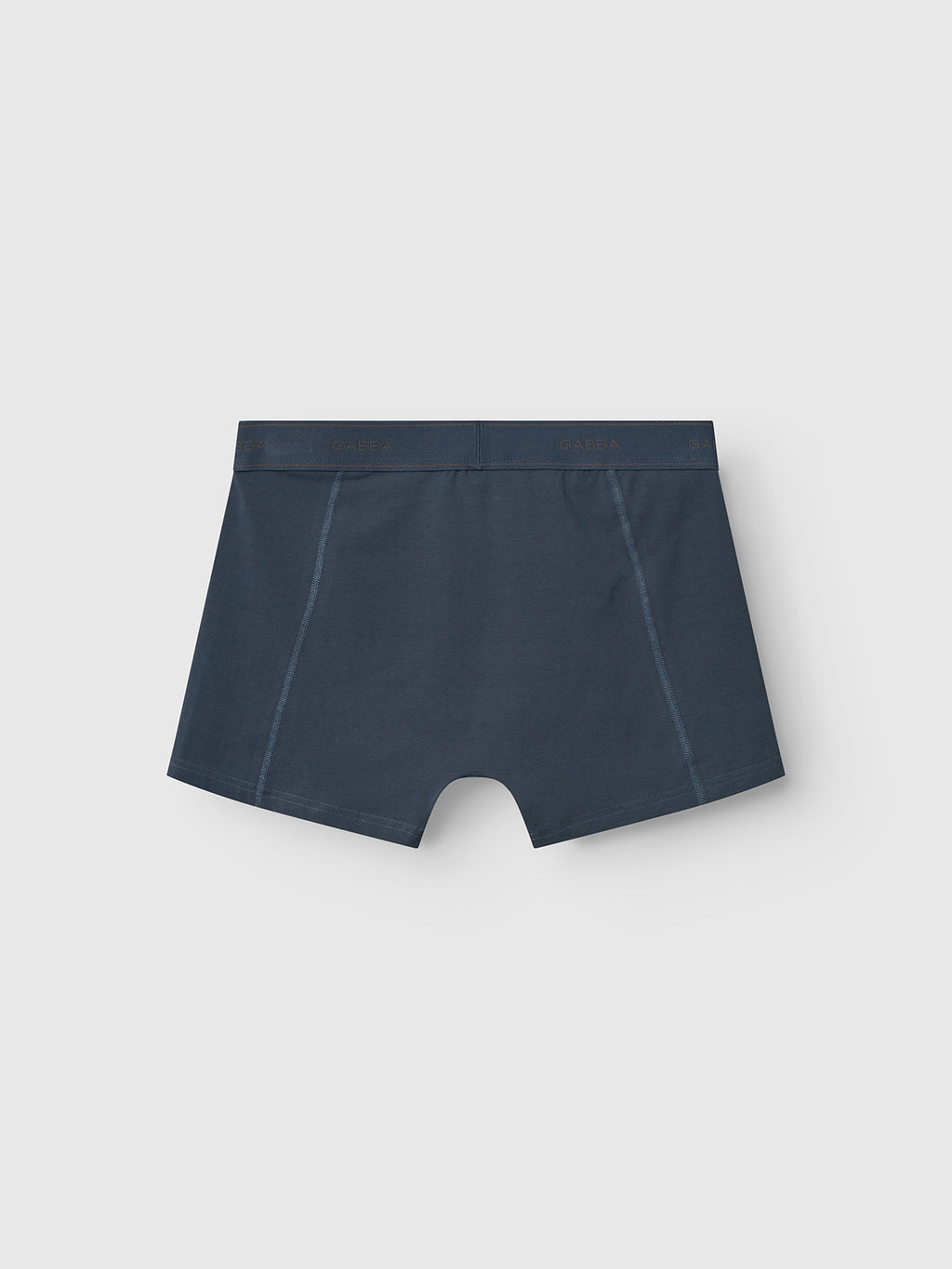 Trunk New - Black Iris boxer briefs by Gabba, shown from the back with a smooth waistband and side stitching, are presented against a plain light gray background—ideal for comfortable men's underwear essentials.
