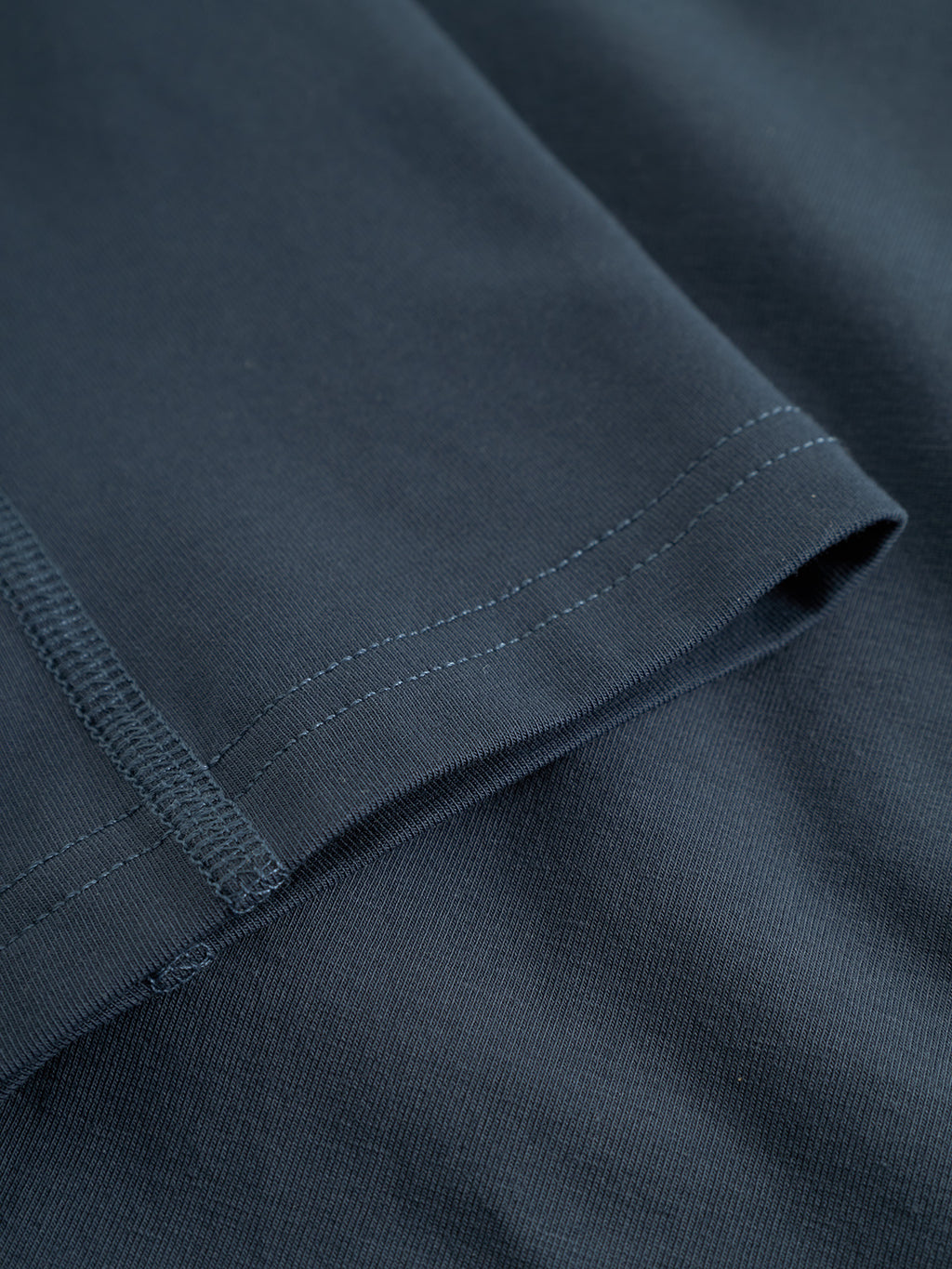 Close-up of the Trunk New - Black Iris by Gabba, highlighting the dark blue soft cotton blend fabric with visible stitching on the hem and seam, showcasing the texture and quality construction of this premium underwear.
